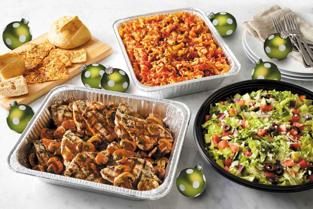 Brio holiday catering pans featuring chicken marsala, pasta, chopped salad, and bread
